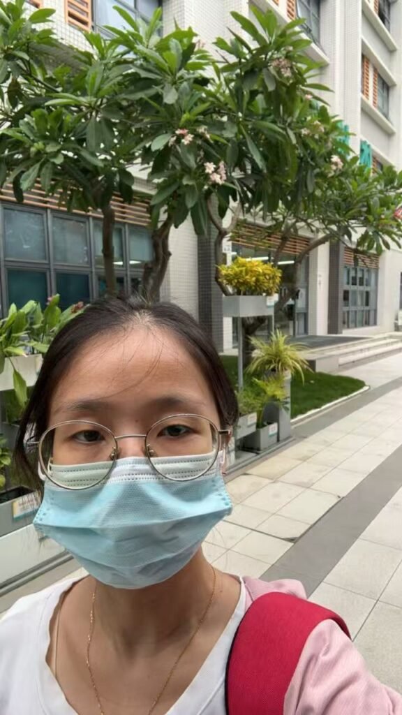 Lucy, Patient Support team member, outside a hospital in Shenzhen