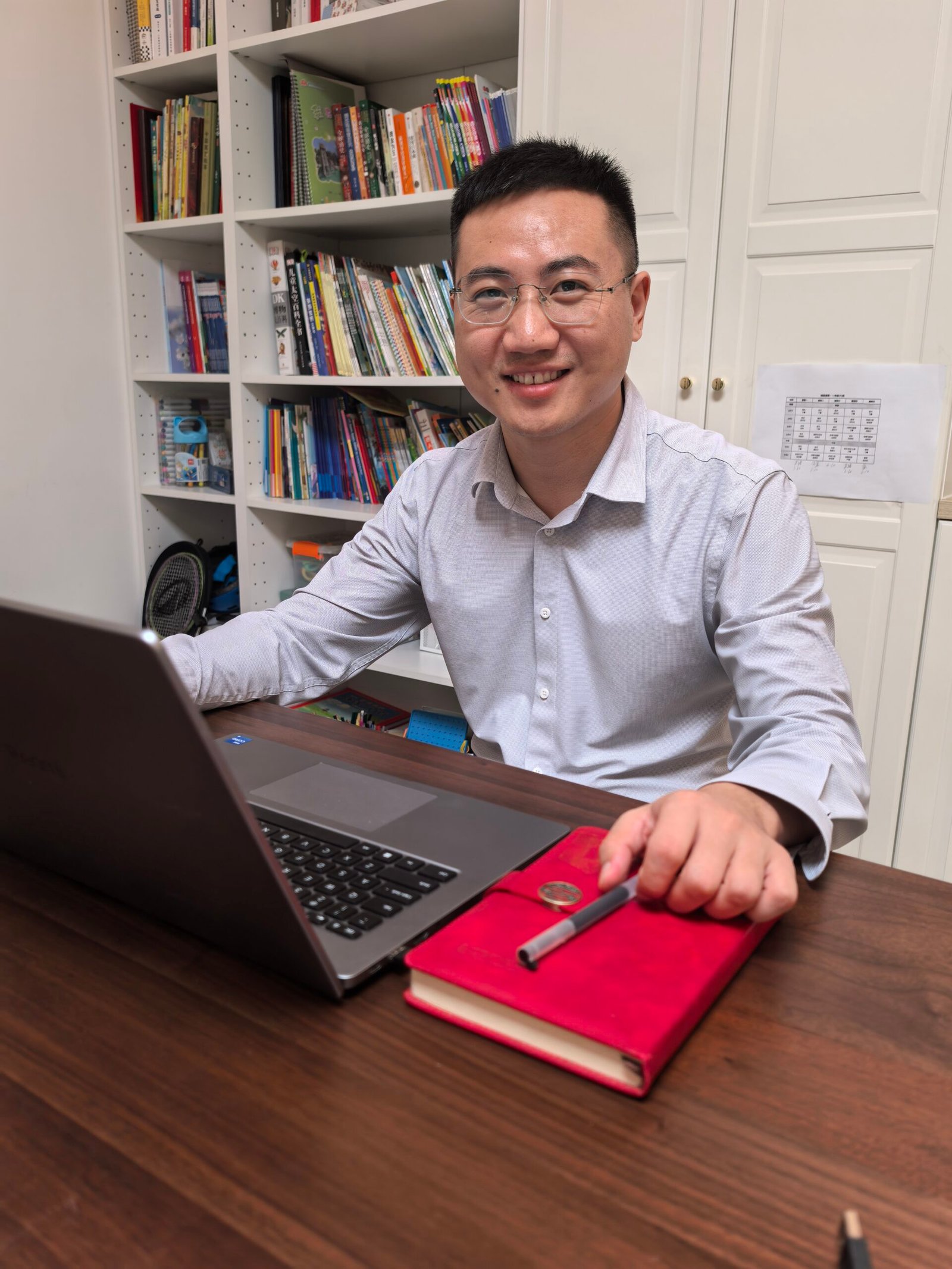 Steven at his desk, coordinating international patient visits